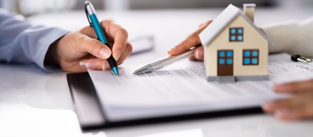 Mapping Data Deal Between HM Land Registry and Ordnance Survey: What It Means for Property Buyers and Sellers 3 people signing property paperwork